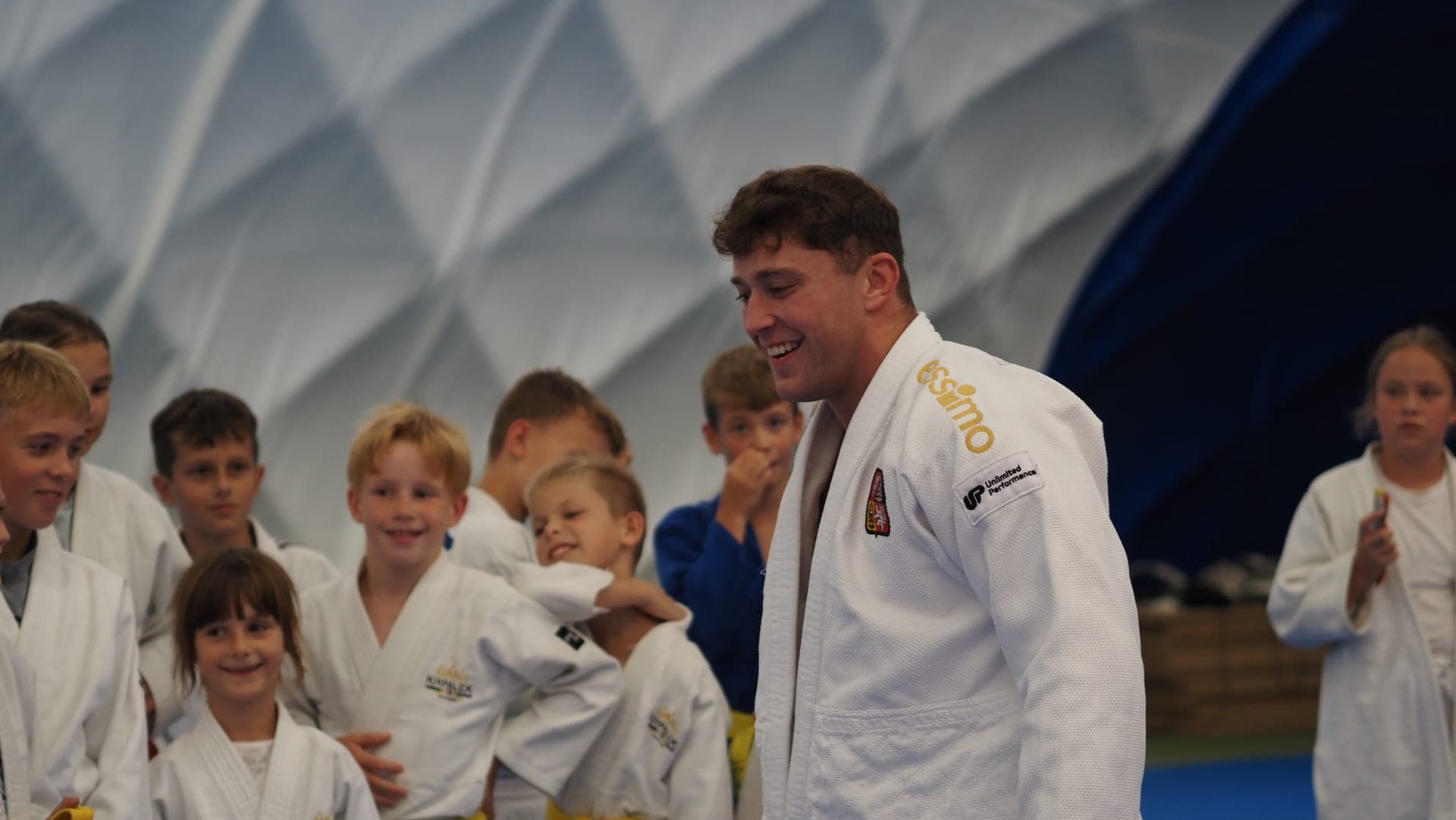 Hostující judoka s dětmi